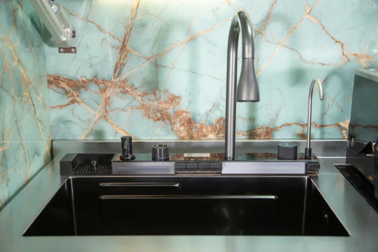 Outdoor kitchen sink with tall faucet and weather-resistant counter