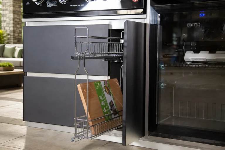 Premium outdoor kitchen with a pull-out basket holding a cutting board