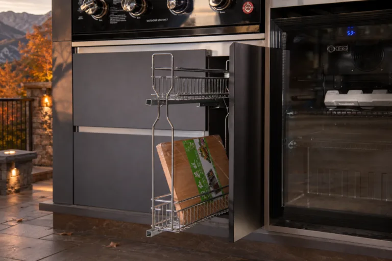 Outdoor kitchen refrigerator and pull-out cabinet in a sheltered mountain patio during late fall