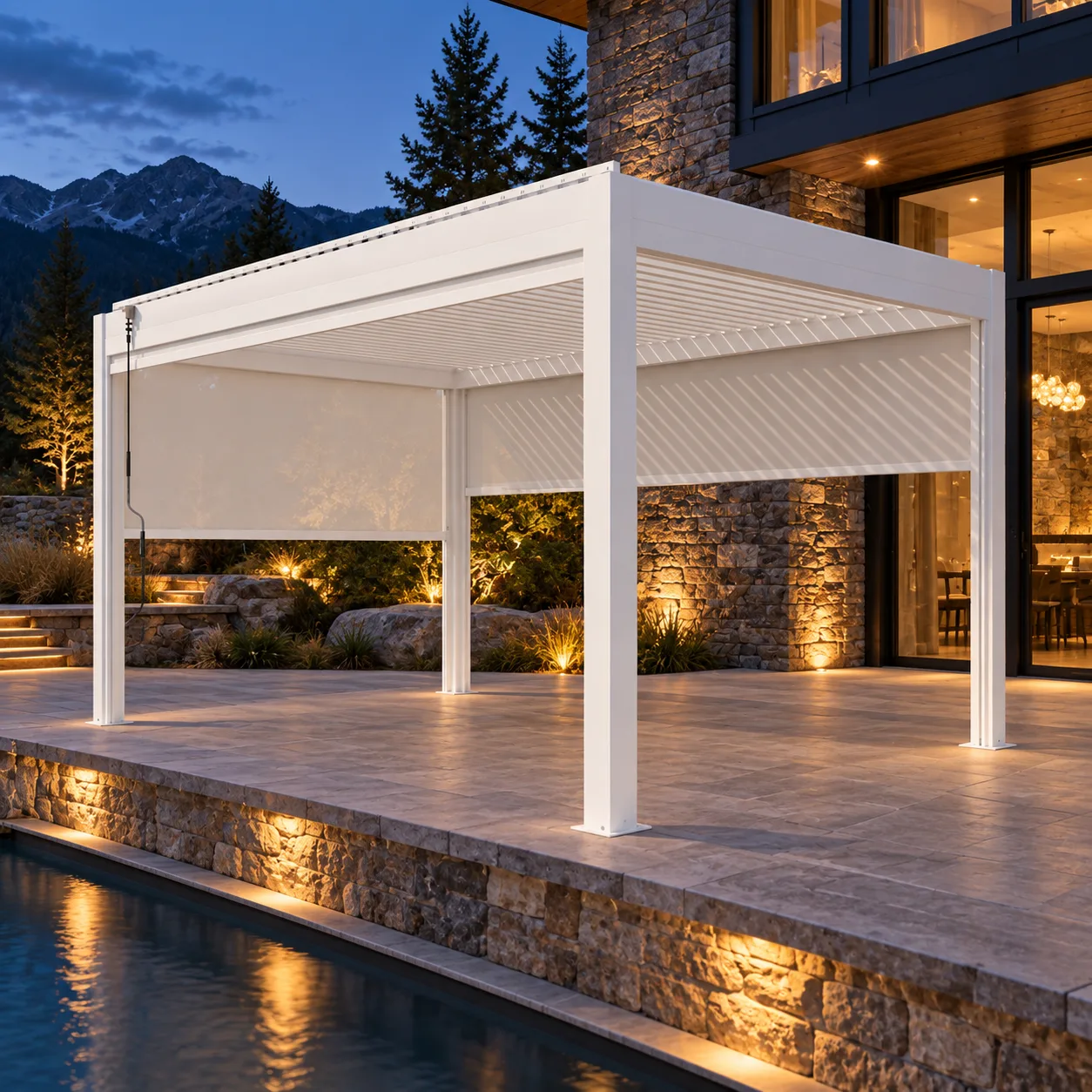 White META LIFESTYLE motorized louvered pergola at an illuminated mountain home patio
